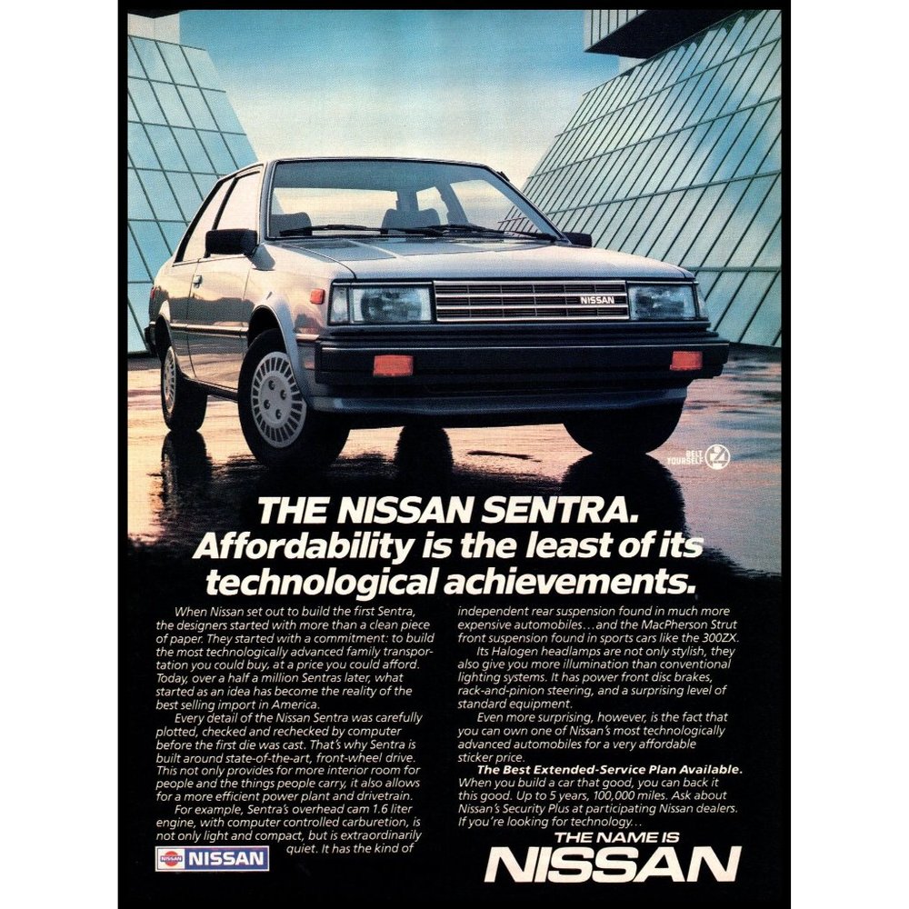1986 Nissan Sentra 2 Door Sedan Vintage Print Ad Glass Buildings Wall Art Photo